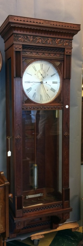 At $45,600, this 77-inch Howard wall clock was the most expensive item in the sale. Two phone bidders battled for it until one bowed out. The face was 13 inches in diameter, and the carved cherry case retained its original surface.