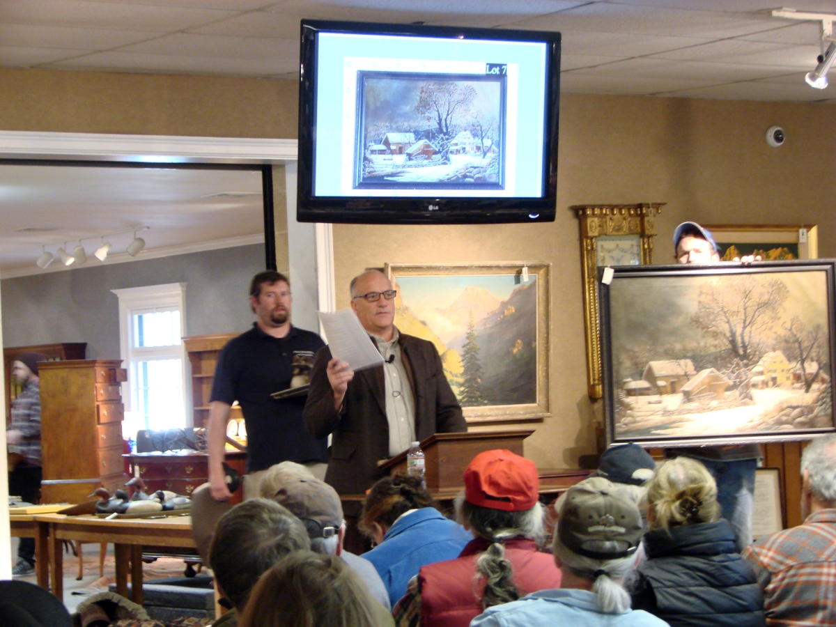 Bill Smith selling the unsigned farm in winter painting that brought $8,625.