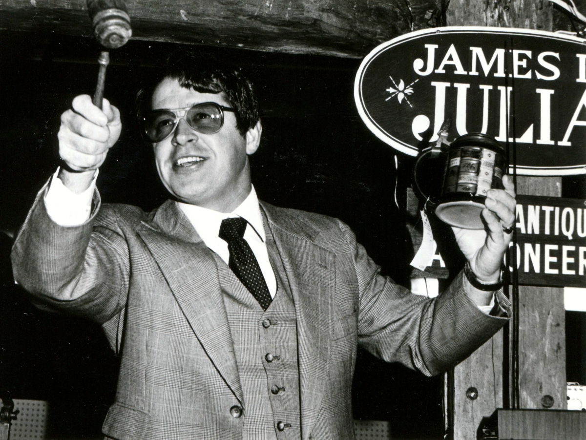 Having been a teacher, the affable auctioneer knows how to command a crowd. If the audience becomes listless or inattentive, Jim resorts to a fast hammer or alters the volume of his voice. On at least one occasion, he tossed a damaged piece into the trash to wake up bidders.
