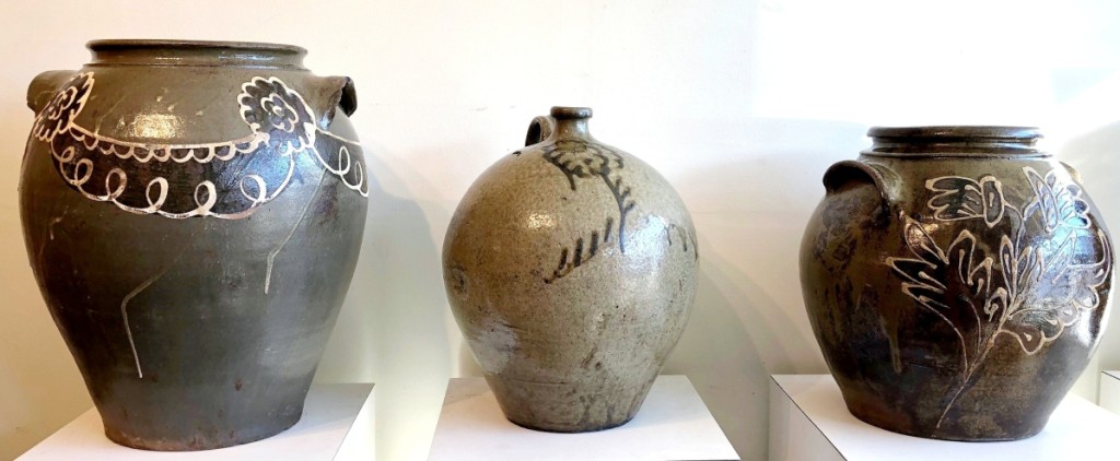 Southern pottery remains the hottest sector of the market. Three alkaline-glazed stoneware pieces from Edgefield, S.C., included, left, a monumental 7-gallon jar, probably by Thomas Chandler, Phoenix Factory, circa 1840. It sold to South Carolina collector Corbett Toussaint in the room for $17,700. A 3-gallon jug, center, attributed to Thomas Chandler, circa 1850, made $5,900 and the 4-gallon jar attributed to Collin Rhodes, circa 1850, sold to a Midwest collector for $29,500.