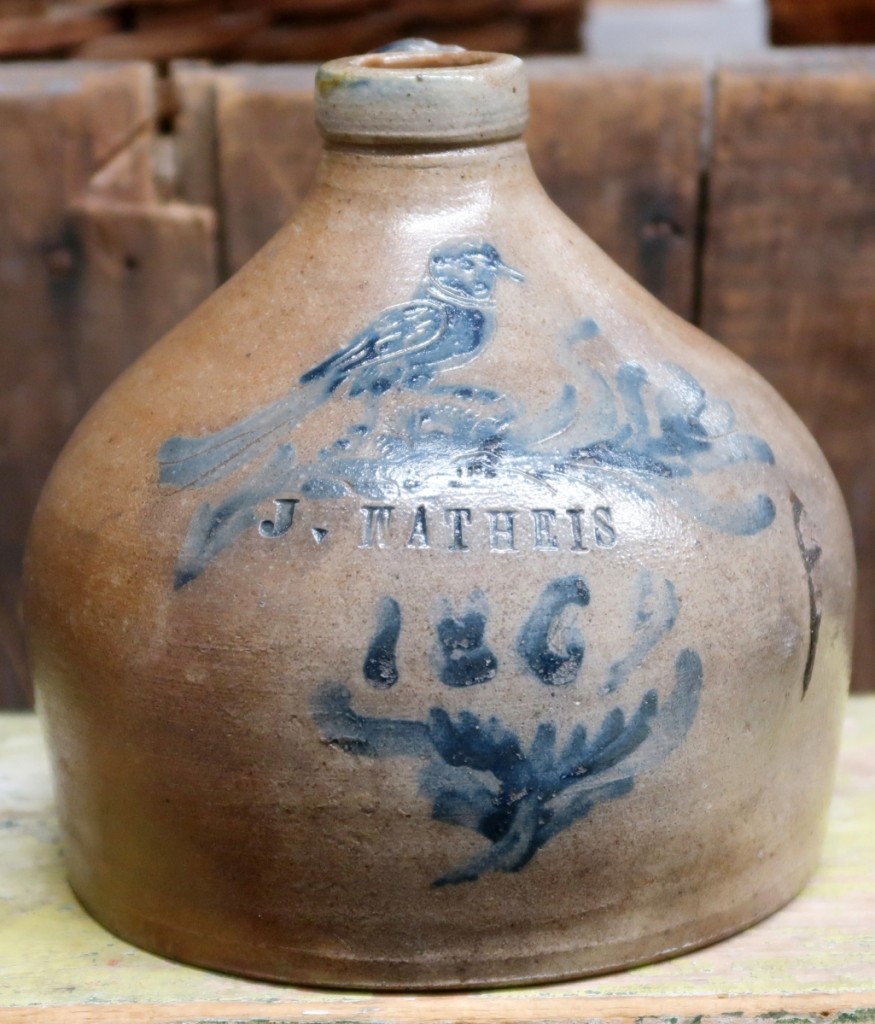 Squat-form stoneware jug inscribed with bird, dated 1862 and marked J. Watheis. Mad River Antiques, North Granby, Conn.