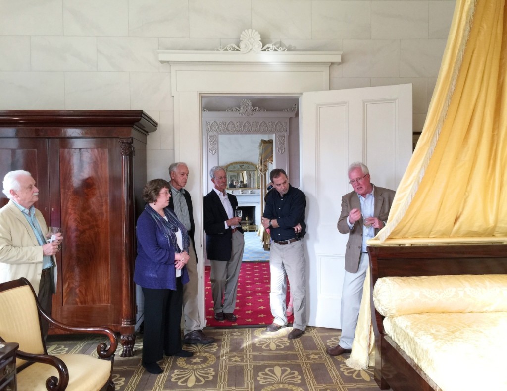 Kenny, here leading a tour of one of the CAHPT houses, spends much of his time writing, speaking, consulting and advising.