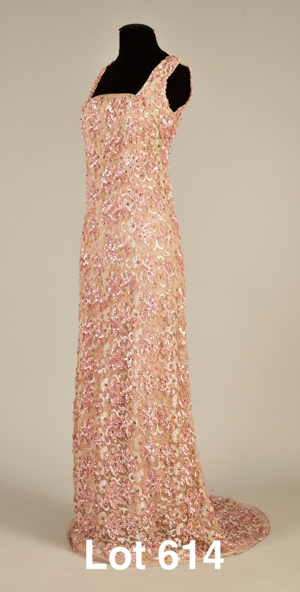 Institutions and private collectors from around the world also vied for Queen Mary’s sleeveless beaded and sequined sheath-dress, worn in the 1930s. This vision of delicate pink frothiness must have been surprisingly weighty to wear; it sold for $26,400.