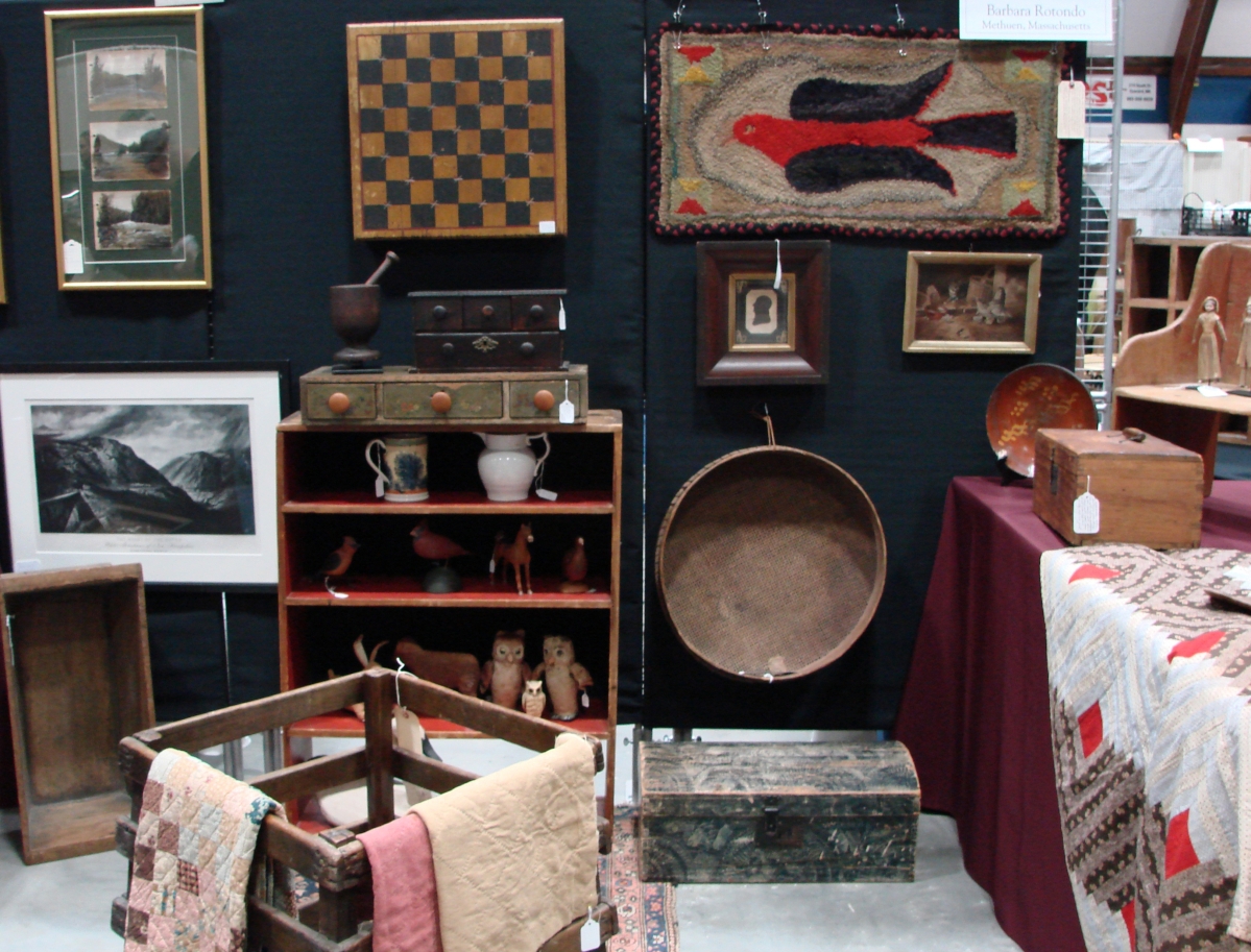 The colorful hooked rug was priced at $425 by Barbara Rotundo, Metheun, Mass. She also had game boards and some small furniture and woodenware, all in old paint.