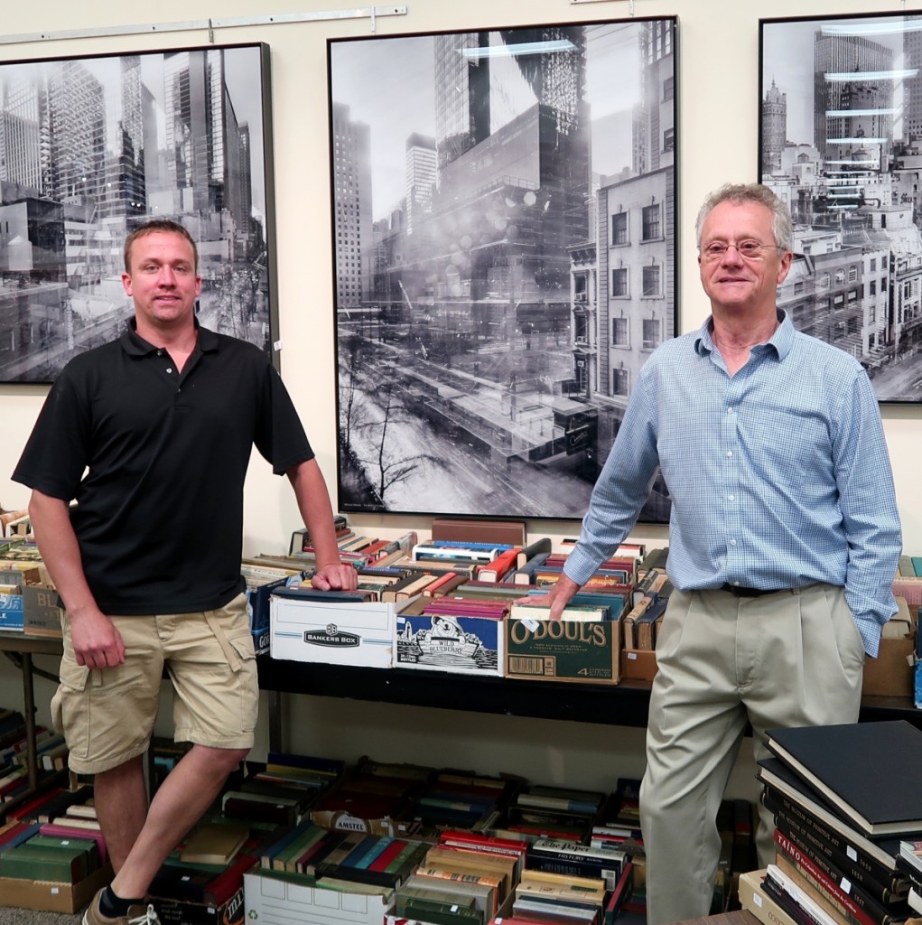 Eddie and Ed Nadeau with three of four large, framed c-prints by German art photographer Michael Wesely (b 1963) depicting the Museum of Modern Art. The images are inscribed “Michael Wesely 9.8.2001-7.6.2004 The Museum of Modern Art for David and Peggy Rockefeller”. The four c-prints brought $12,535.