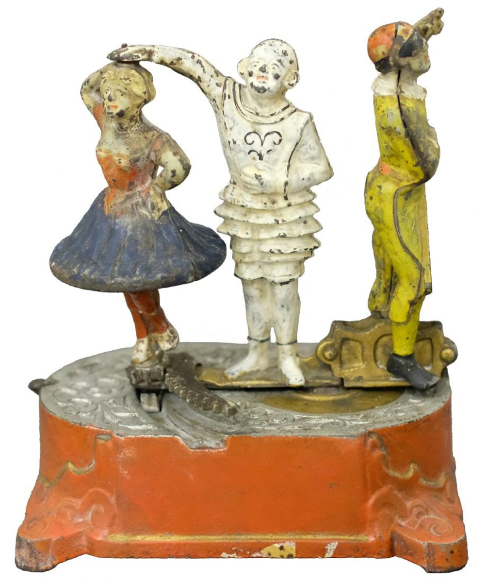 Lot 85, the Clown, Harlequin and Columbine bank, made by J&E Stevens, Cromwell, Conn., circa 1890s, sold for $108,000, just under high estimate of $120,000. The catalog notes that “The Harlequin Bank is one of the most beautiful and complex cast iron toy bank ever produced. The bank presents us with three distinct theatrical personalities set upon a stage of glittering silver and gold.”