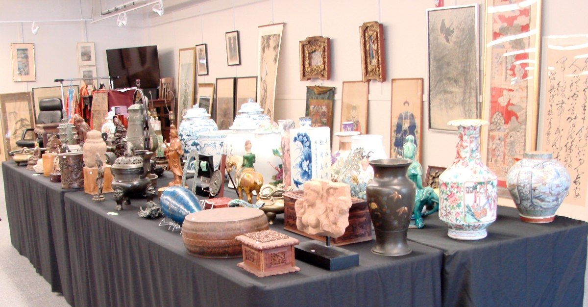 Ceramics and other material neatly displayed during the preview.