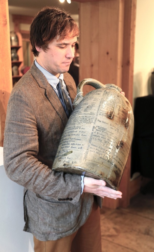 Mark Zipp holds the top lot of the day, an Anna Pottery fair jug.