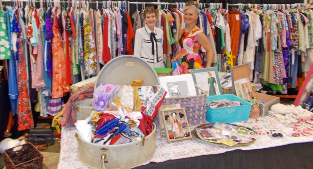 Modeling their antiques, Freddi Brubaker (left) and Charlotte Bevers were also putting the finishing touches on their display of vintage fashions.