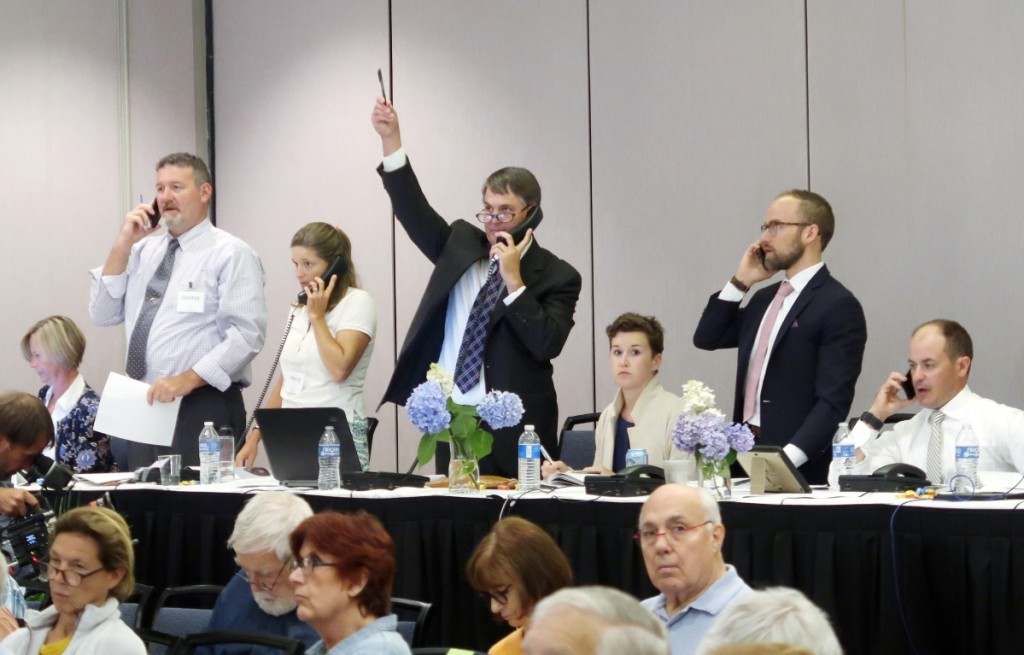 Seasoned bidders participated by phone on the top lots. Here, Copley chief executive officer Stephen O’Brien Jr hoists his paddle against competition from, standing from left, George Foster, Chelsie Olney and decoy specialist Colin McNair.