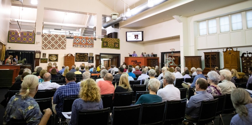 The salesroom was nearly full early on, as evidenced by this photo showing company vice president and auctioneer Jamie Shearer selling lot six, a William and Mary cherrywood shoe foot hutch table. With provenance to Deerfield Academy and Lillian Blankley Cogan, it realized $8,125, just ahead of its estimate, $4/8,000. To Shearer’s right are Sandy Hengst, Cindy Hauer and James Pook, who alternated helping the auctioneer the sale and running the Bidsquare bidding platform.