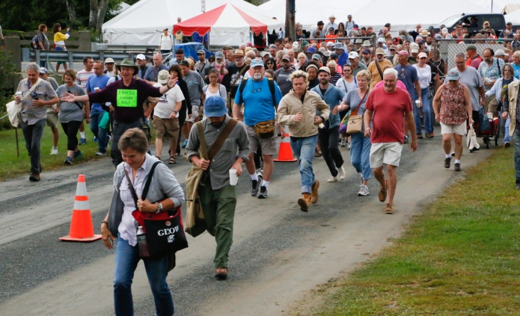 Buyers spring through the opening gate at Brimfield Auction Acres.