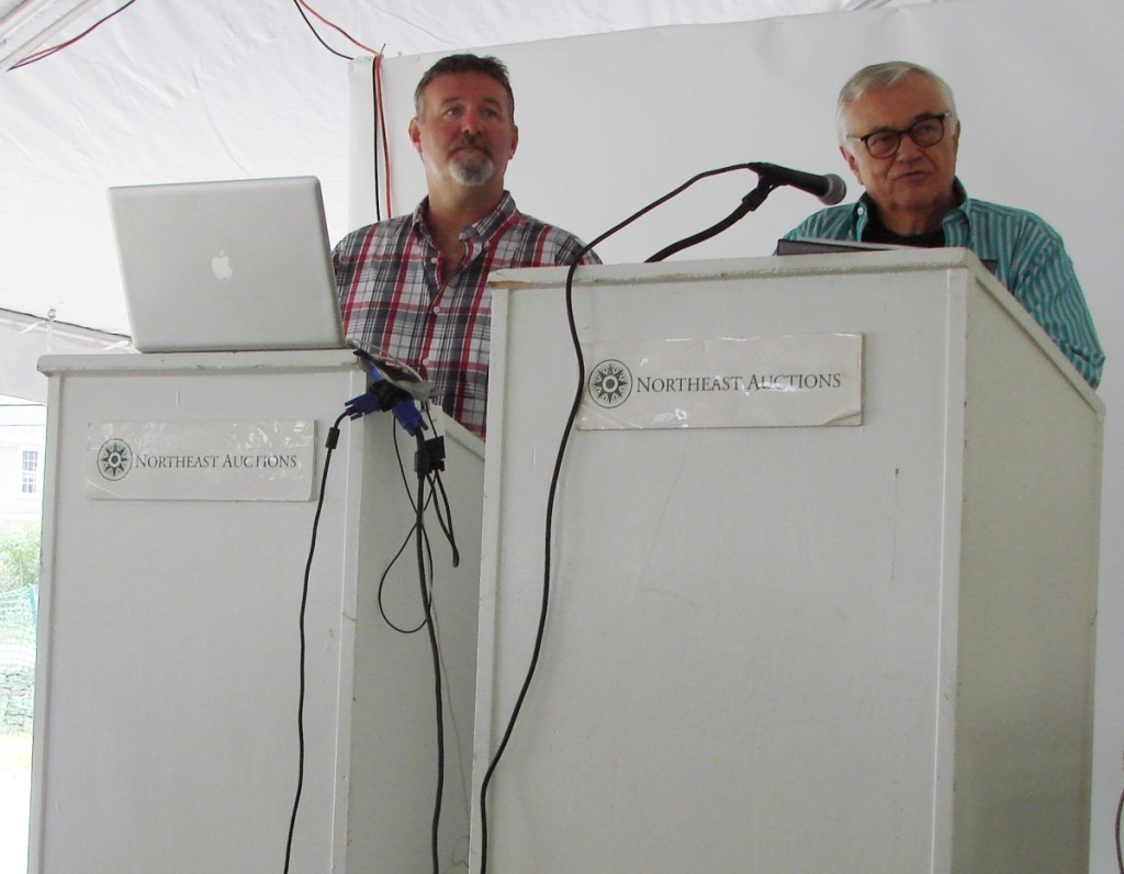 Ron Bourgeault, right, explains the terms of the sale before it starts.