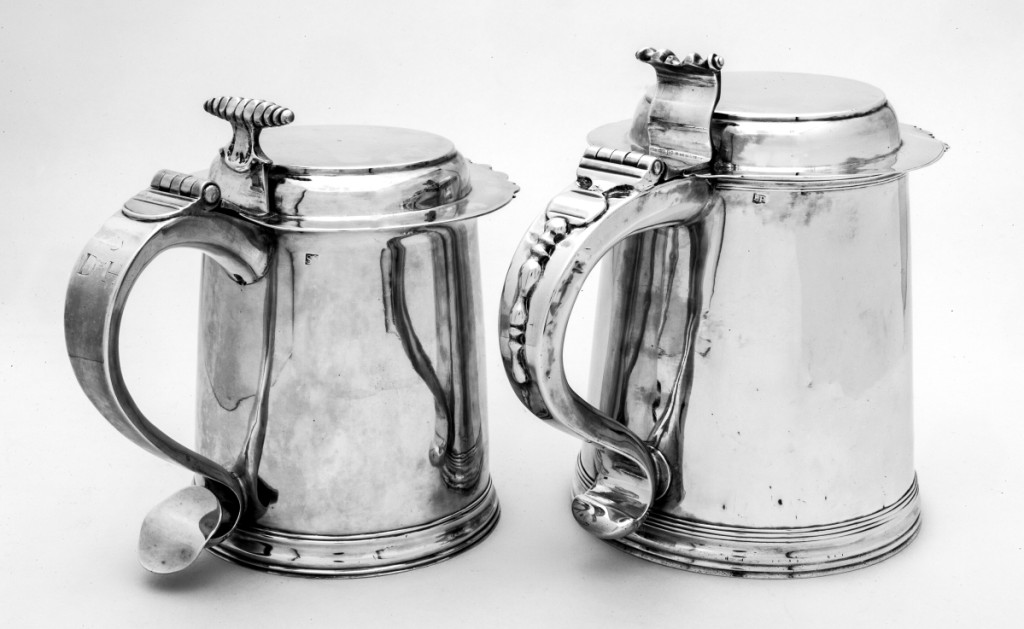 Left, flattop tankard marked by Simeon Soumaine (baptized 1685–circa 1750), New York City, 1730–1750. Engraved on handle with block initials “S/D*H,” for Daniel 2d (1690/1–1763) and Hannah Brewster Smith (169 –1761); engraved on base in later script “David & Hannah Smith/Smithtown, Long Island/1691–1763.” Silver; height 6-  inches. Preservation Long Island, gift of Miss Alice Lawrence. Right, flattop tankard marked by Elias Pelletreau, 1750–1776. Engraved with block initials “I/I*M” on base. Silver; height 7½ inches. Preservation Long Island, gift of Howard C. Sherwood, 957.608. Photo Glenn Castellano. The Soumaine tankard came down in the family of General John Smith (1752–1816), a US Representative and Senator, the grandson of Daniel 2d and Hannah Brewster Smith, to the donor.