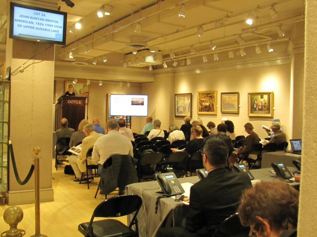 With internet, phone and absentee bidding available to buyers, auctions do not draw the large crowds they once might have, but Doyle’s attracts a devoted following of buyers who still like to attend sales in person. Here, Doyle’s executive vice president, Joanne Porrino Mournet, is shown auctioneering at the beginning of the sale.