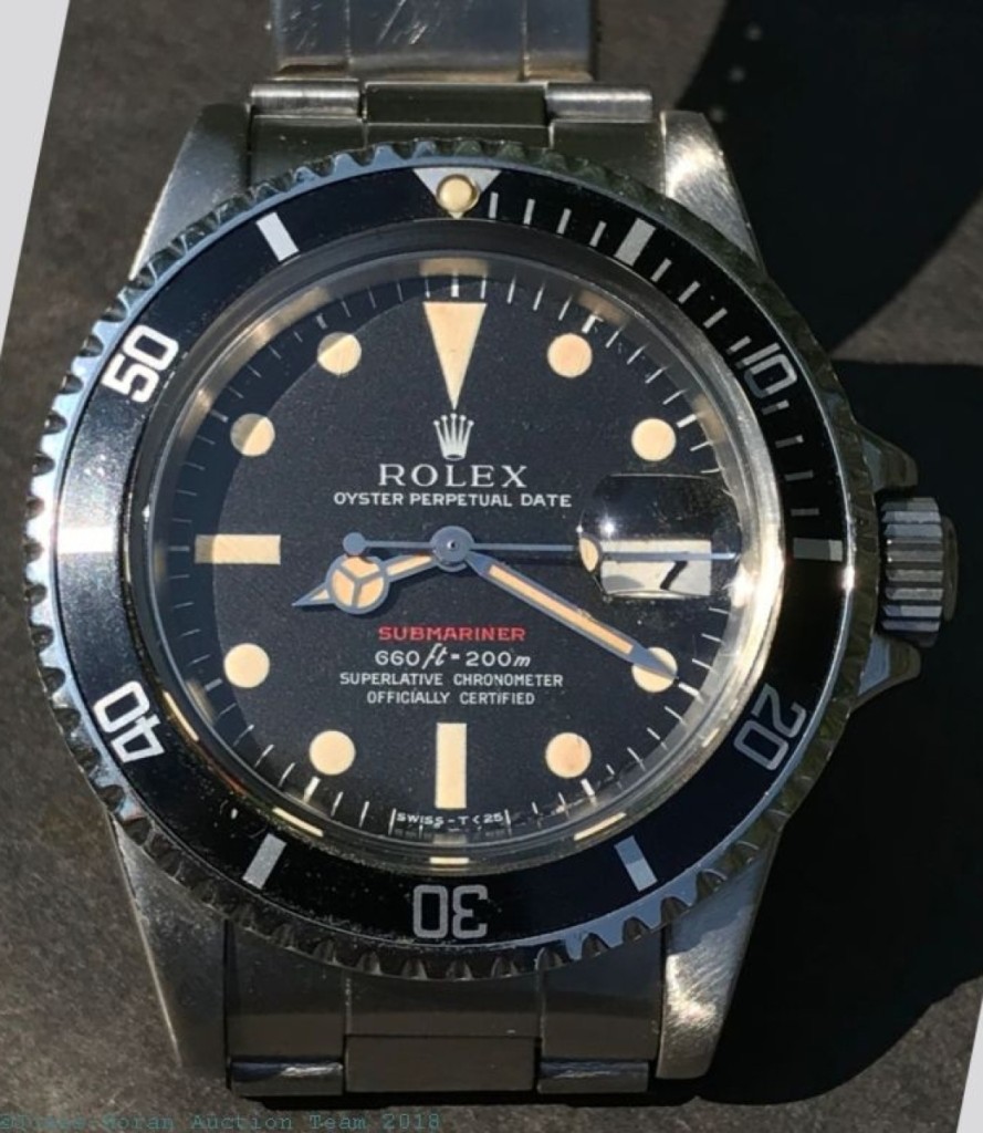 Top lot in the sale, this Rolex Oyster Perpetual Date “Red Letter Submariner” brought $26,500.