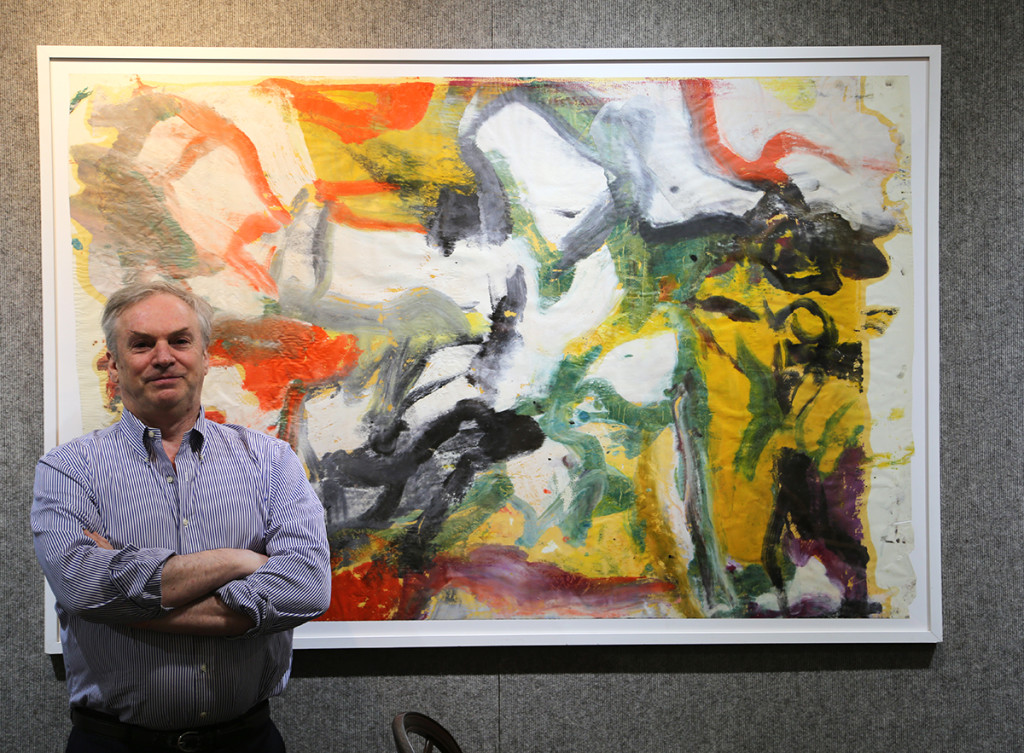 David Killen stands with the 65-by-43-inch Willem de Kooning painting on paper. The work was found in a storage locker in 2016 and brought $1.2 million in his October 14 sale. Killen has four more de Kooning works that he will offer before the end of the year, two similar to the one pictured here. 