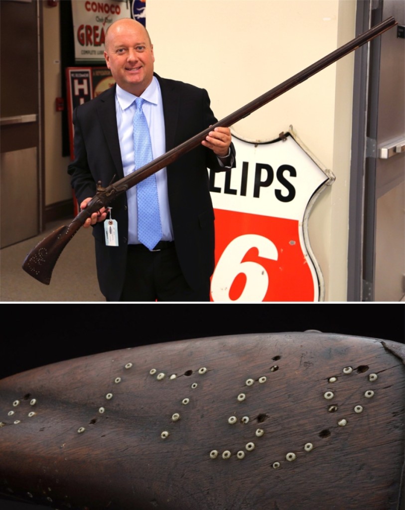 Dan Morphy, president and auctioneer, holds the top lot of the sale, a French Fusil de Chasse, which brought $102,000. It featured Wampum beads inlaid into the wood components with the initials IW and the year 1759. Specialist David Geiger said, “This is one of the best-known Indian beaded guns extant, with an early date on it. Authentic specimens that have Wampum beads are very rare.”