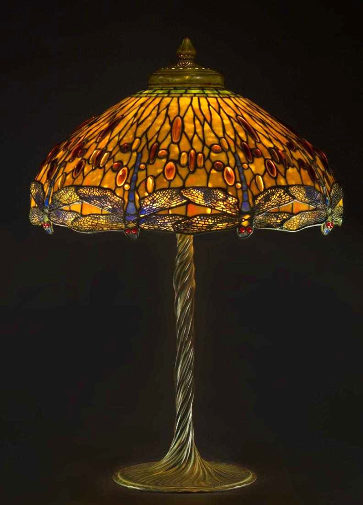 The top lot of the auction was this Tiffany Studios (N.Y.) drop head Dragonfly lamp, circa 1910, having a verdigris patinated leaded glass shade with jewel cabochons sold at $200,000.