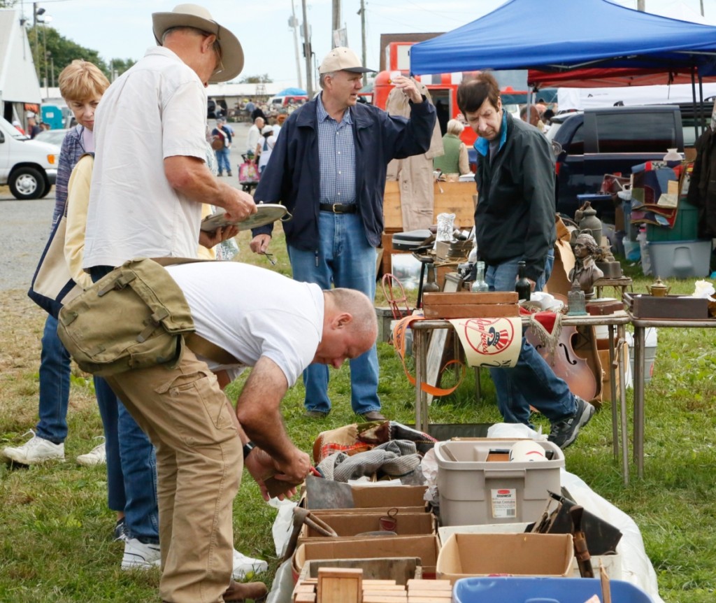 Buyers could not resist the line of boxes on the ground in this dealer’s booth. There was no rhyme or reason to what was in each one, so you had to go through them all.