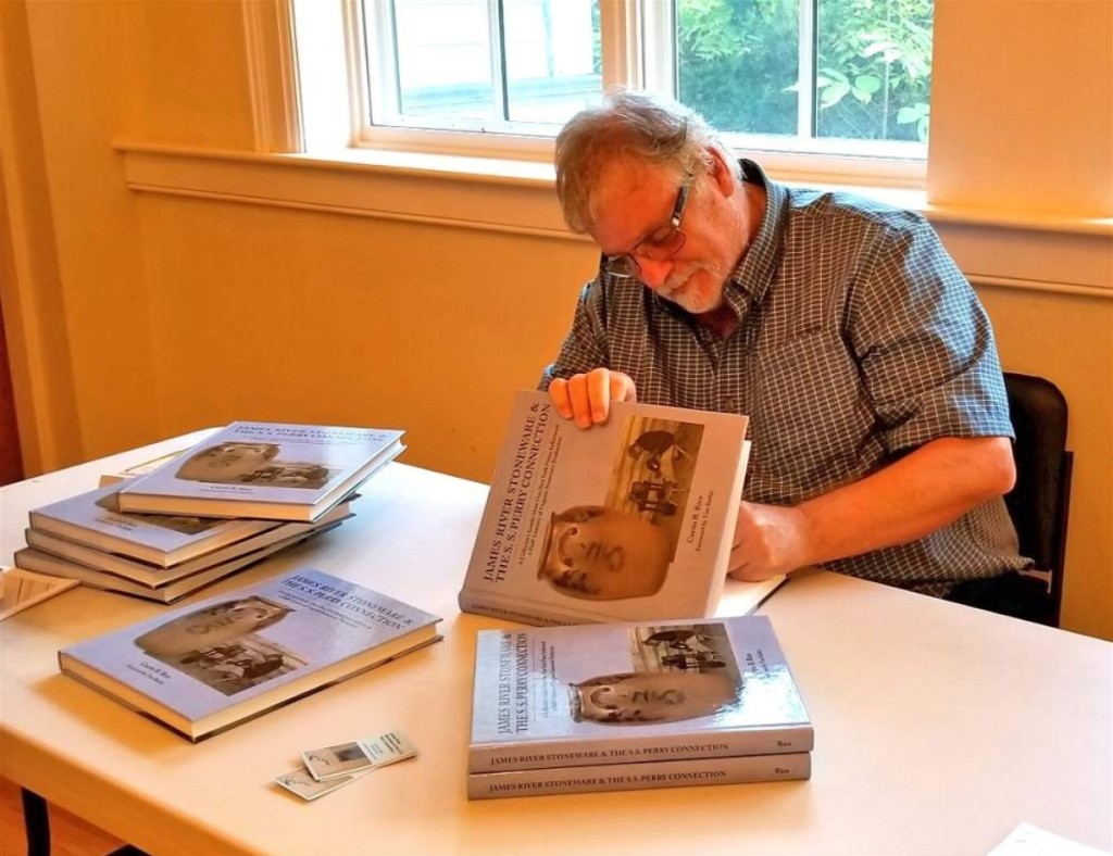 Curtis Rice signs copies of his new book James River Stoneware and the S. S. Perry Connection.