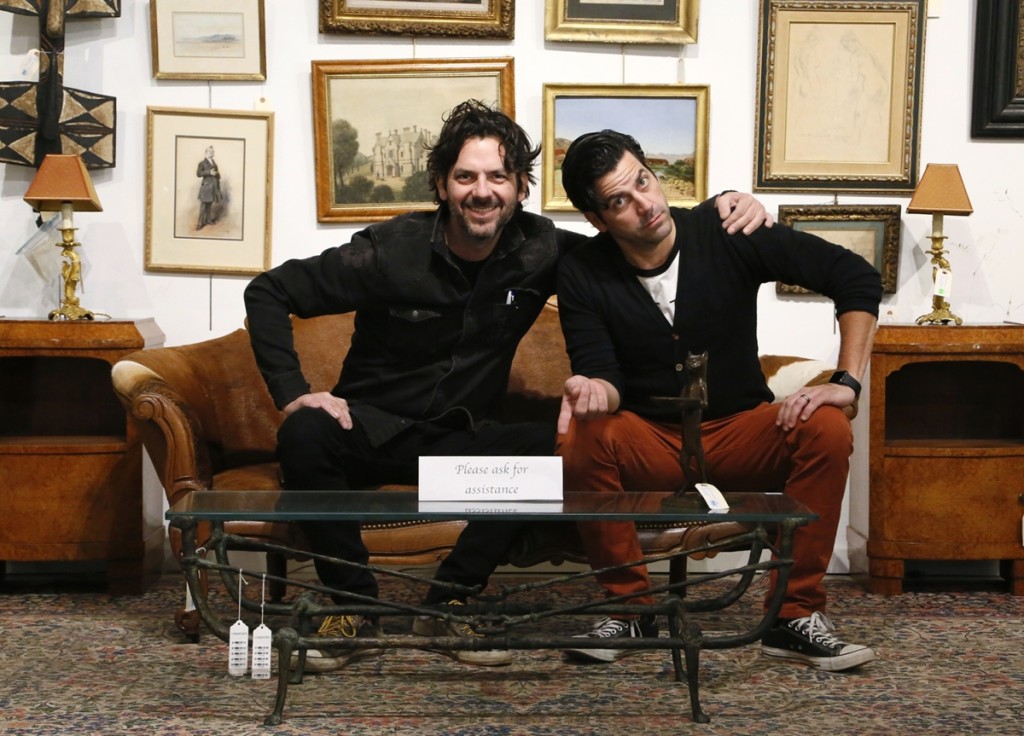Brothers Michael, left, and Mark Millea sit behind a second edition Table Berceau from Diego Giacometti that went out at $21,600 in their eponymous firm’s November 15–17 auction. Sitting on the table is Giacometti’s standing bronze cat titled “Chat maitre-d’hotel,” which effortlessly blends in with Mark’s shirt and was the top lot of the $2.1 million sale.