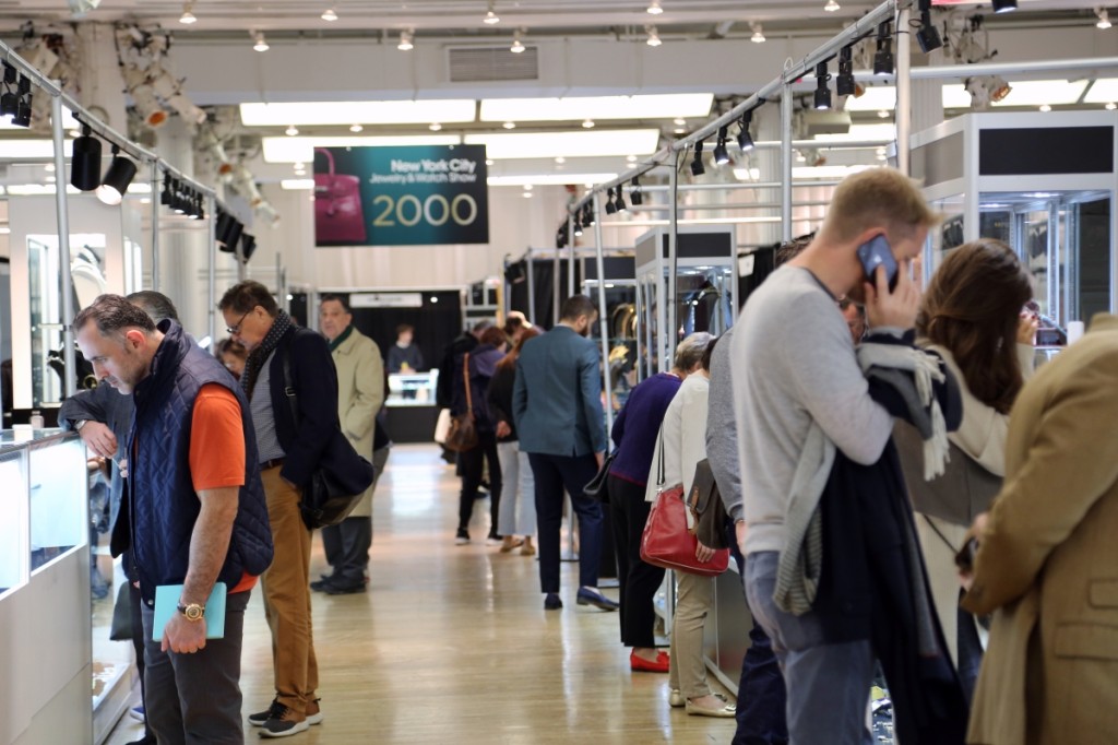 Looking — and buying — at midday on the floor of the New York City Jewelry and Watch Show.