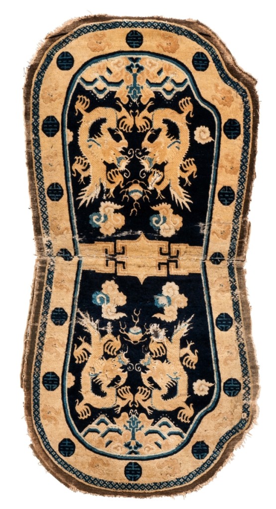 Fetching $19,680 was this Dragon saddle rug, western China, circa 1800, 4 feet 6 inches by 2 feet 3 inches.