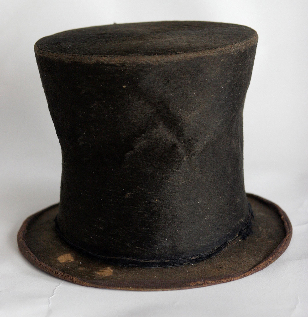 In this June 14, 2007 file photo, Abraham Lincoln's iconic stovepipe hat of questioned authenticity is photographed at the Abraham Lincoln Presidential Library and Museum in Springfield, Ill. Historians say that the 2007 acquisition of 1,500 documents and artifacts for the Abraham Lincoln Presidential Library and Museum firmly established Illinois as a leading repository of all things Lincoln. So forgive the handwringing over the possibility that some of it might have to be sold. The Lincoln museum's fundraising foundation, which borrowed $23 million in 2007 to buy the trove from private collector Louise Taper, still owes $9.2 million on a note due in October 2019. (AP Photo/Seth Perlman File)