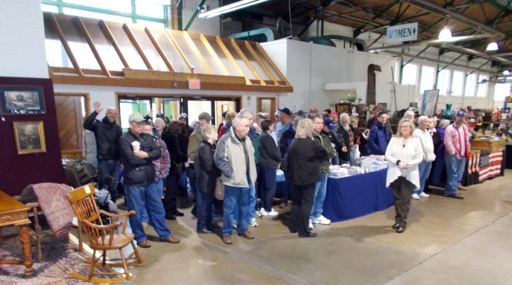 Judy Allman greets a large opening crowd the last minute before the Saturday opening.