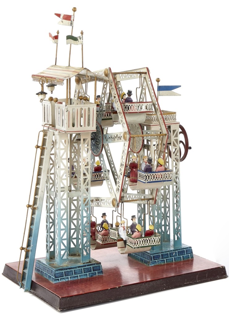 This Doll & Cie painted Ferris wheel steam toy #729/5, with composition figures, is the largest of the Ferris wheels with six seats, each with four riders. It measures 17 inches high, 13½ inches wide and 11 inches deep. It is in overall excellent condition and the web and phone battled it out for this lot. The phone bidder finally won, paying $21,960 for the Ferris wheel, close to twice the high estimate.