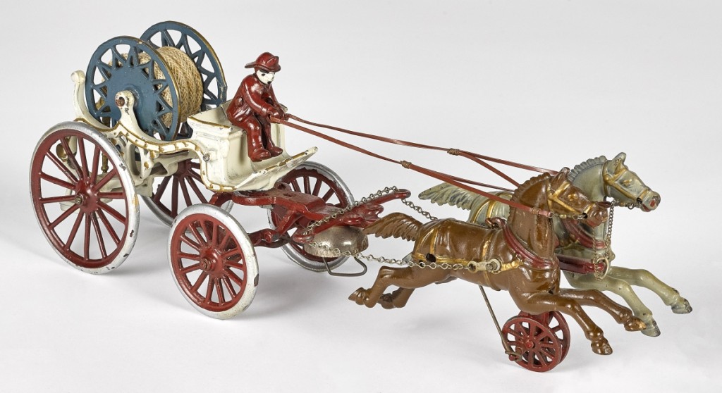 From a selection of cast iron horse-drawn toys was this hose reel with painted cast iron driver. It was in excellent condition and brought $3,904 against an $800 high estimate.