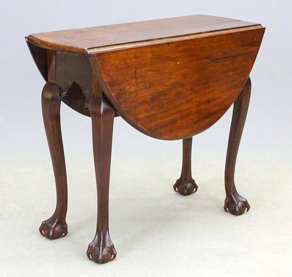 With market sentiment down on period furniture, auctioneer Seth Fallon said he expected this Eighteenth Century diminutive dropleaf table to do well because of the sophisticated carved ball-and-claw feet but was unsure to what extent it would achieve a good price. Measuring 31 by 12 inches with 12-inch leaves, the piece soared from its $500–$1,000 estimate to bring $20,400 from a Kansas City, Mo., dealer bidding on the phone.