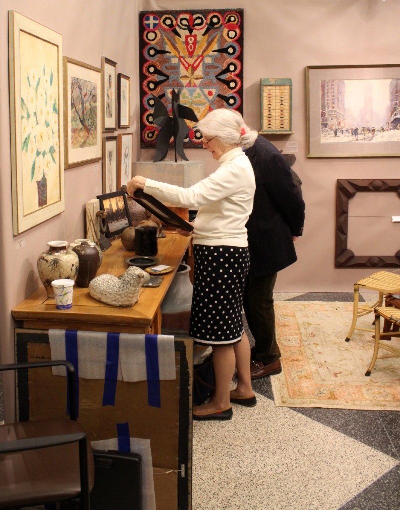 Customers browse the offerings by Garvey Rita Art & Antiques, Orleans, Mass.