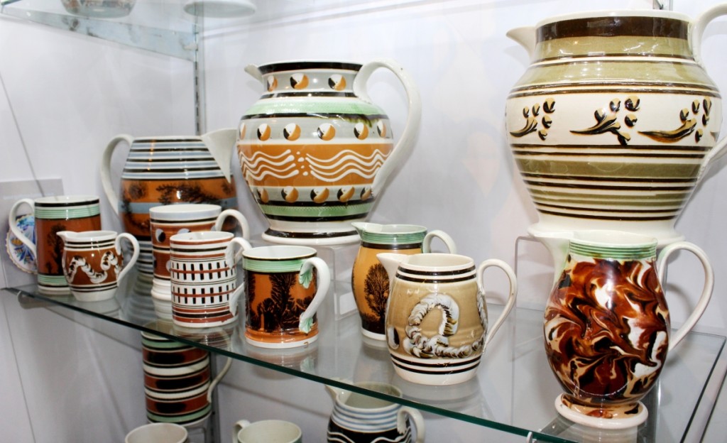 A shelf of mochaware, which accounted for the majority of sales to private collectors by Martyn Edgell Antiques. “The show went very well,” said the English dealer. “Everyone seemed to like the new format. We had a good number of people attend, including from museums as well as the general public and had many sales.” In addition to the mochaware, the firm sold salt glaze, creamware and redware. “There was also a lot of interest in the Westerwald, and we sold several pieces of that,” said Edgell.