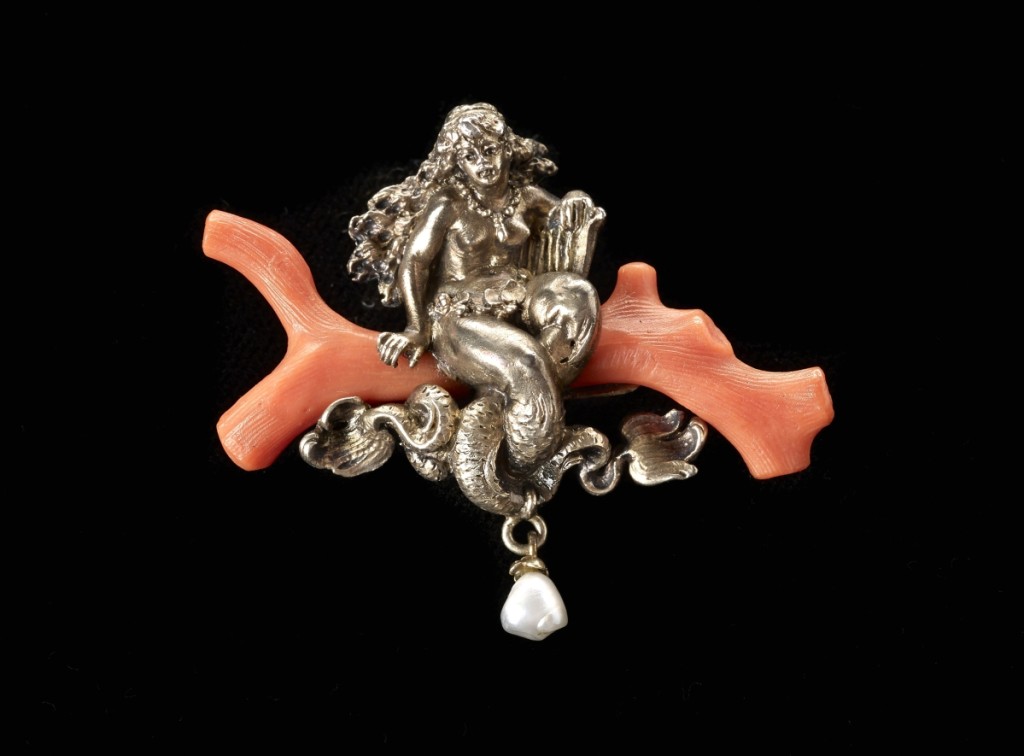 Karl Rothmüller, Mermaid on Coral brooch, circa 1900, gilded silver, coral, pearl. Collection of Richard H. Driehaus. John A. Faier photo, 2014, ©The Richard H. Driehaus Museum.