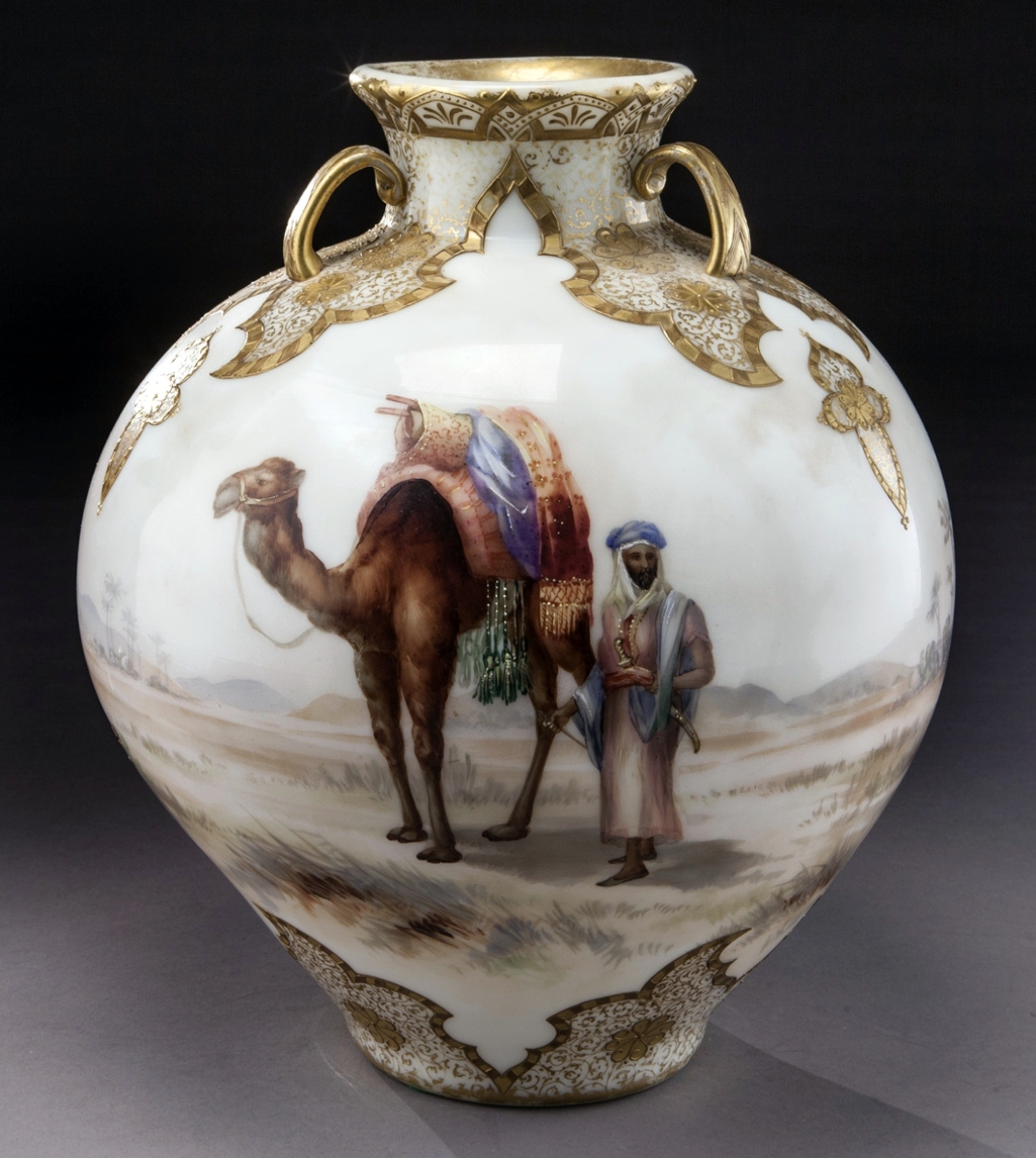 From the John W. Lolley collection, this Mount Washington colonial ware “Garden of Allah” glass vase decorated with Egyptian scene of camels Bedouin was the top seller in the first offering, settling within estimate at $5,938.
