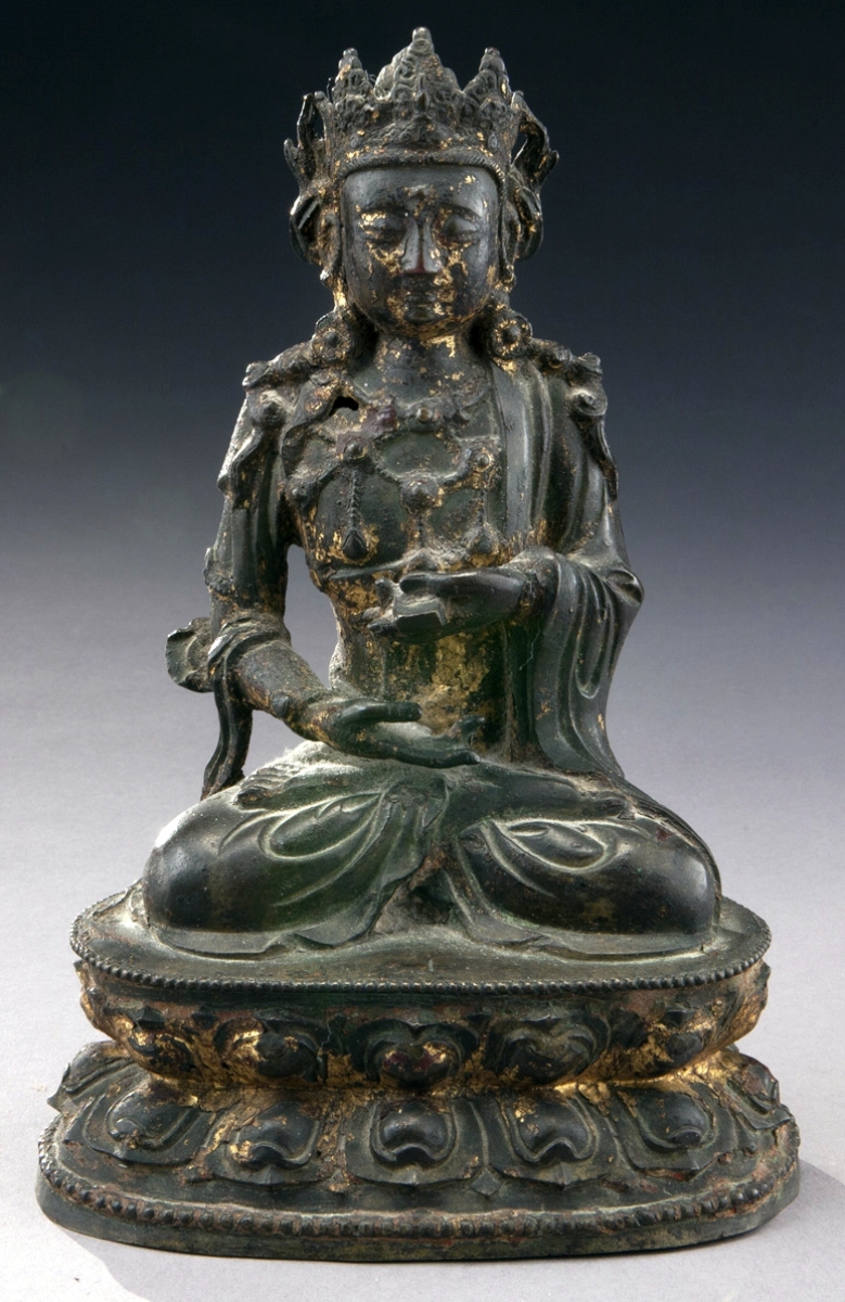 Chinese Ming gold lacquer bronze Buddha seated on a lotus throne rose to $13,750.