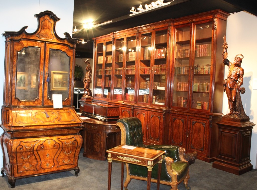 One of the highlights Butchoff Antiques, London, brought to the show was this circa 1825 eight-door mahogany library bookcase attributed to Gillows. A music box, numbered 20482, by B.A. Bremond of Geneva sits on the pedestal desk in front of the bookcase.