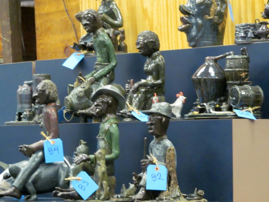 A group of Lin Craven sculpture forms. This group represented a moonshine still and various black folks at some task.