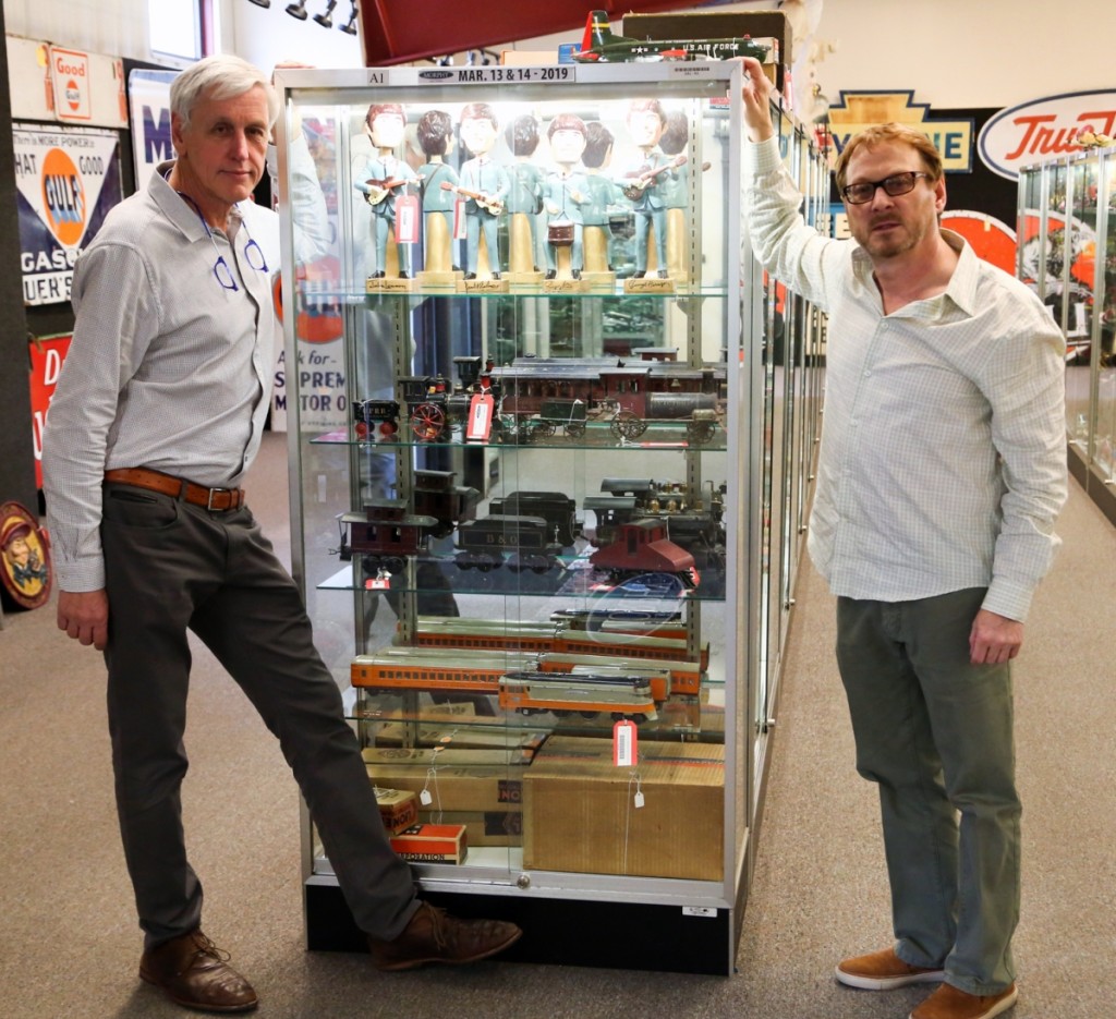 Left, Jay Lowe, the head of Morphy’s doll division, and Tom Sage Jr, right, head of Morphy’s toy and train division, stand together following the first day of the sale.