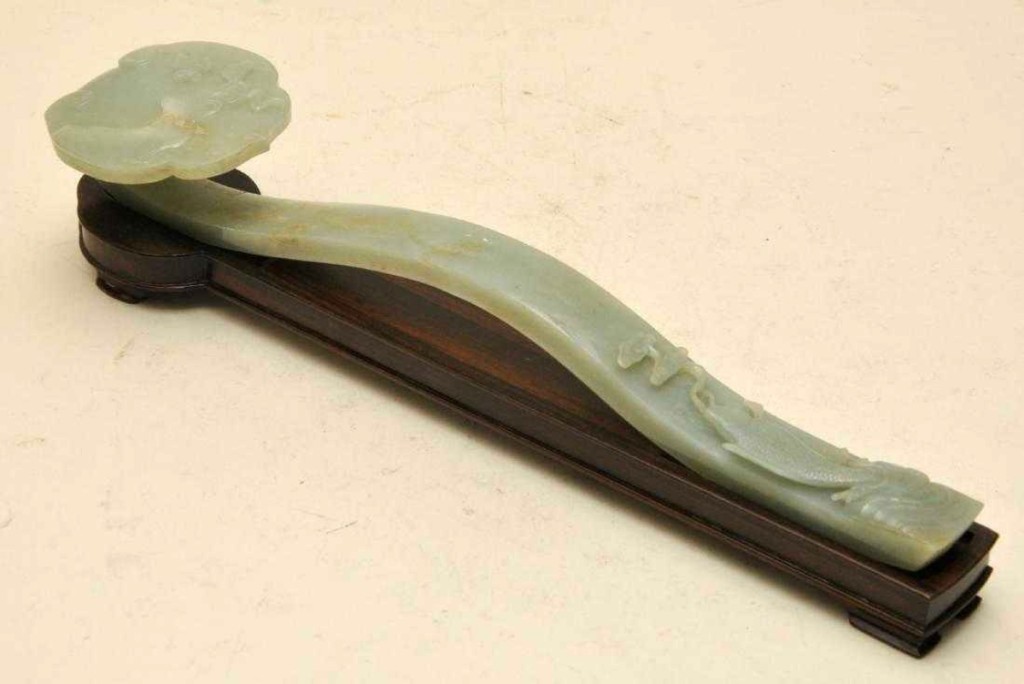 The highest priced item in the sale, bringing far over the estimate, at $30,940, was cataloged as a Nineteenth Century pale celadon jade scepter, 15½ inches long. The carving represented a fish and raptor. It was one of a small consignment of jade from one collector.