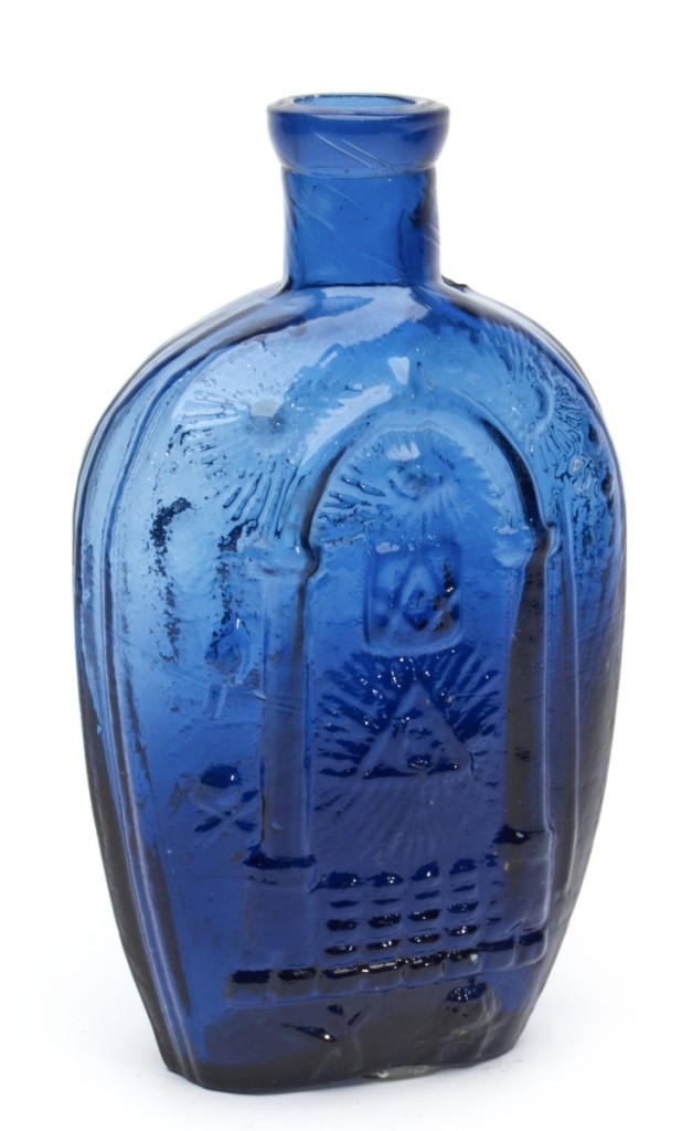 The top lot was this Masonic arch and emblems, eagle and “J.K / B.” historical flask, Keene Marlboro Street Glassworks, Keene, N. H., 1815–30, which sold at $71,370. The rich cobalt blue in the lower half shading to a medium cobalt blue in the upper half contributed it its appeal.