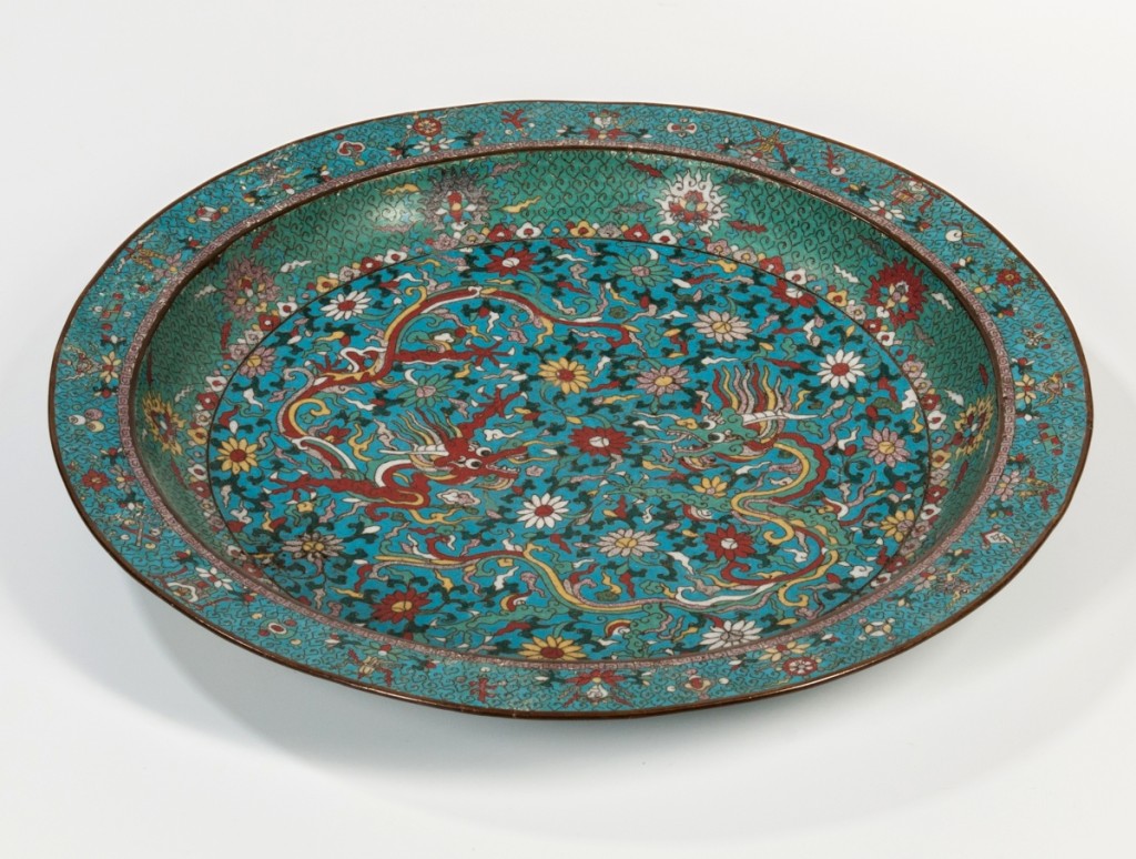 Leading the sale was this large cloisonne charger with dragons, China, early Twentieth Century, Ming dynasty style. It realized $315,000.