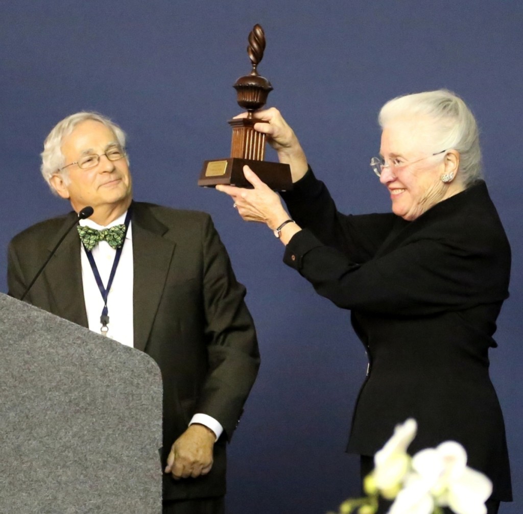 Arthur Liverant presents the 2017 Award of Merit to Patricia E. Kane.