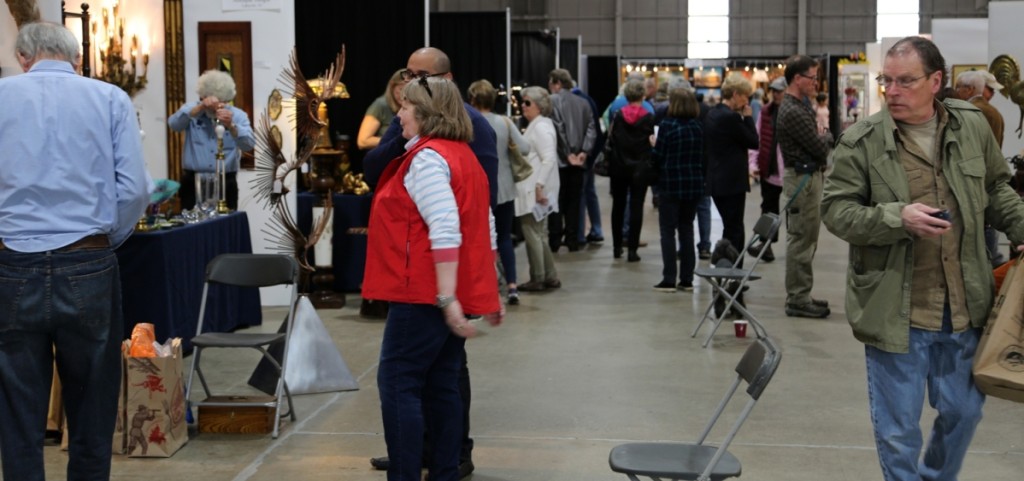 This is what commerce looks like. Buyers walk between booths shortly after the show opened on Saturday.