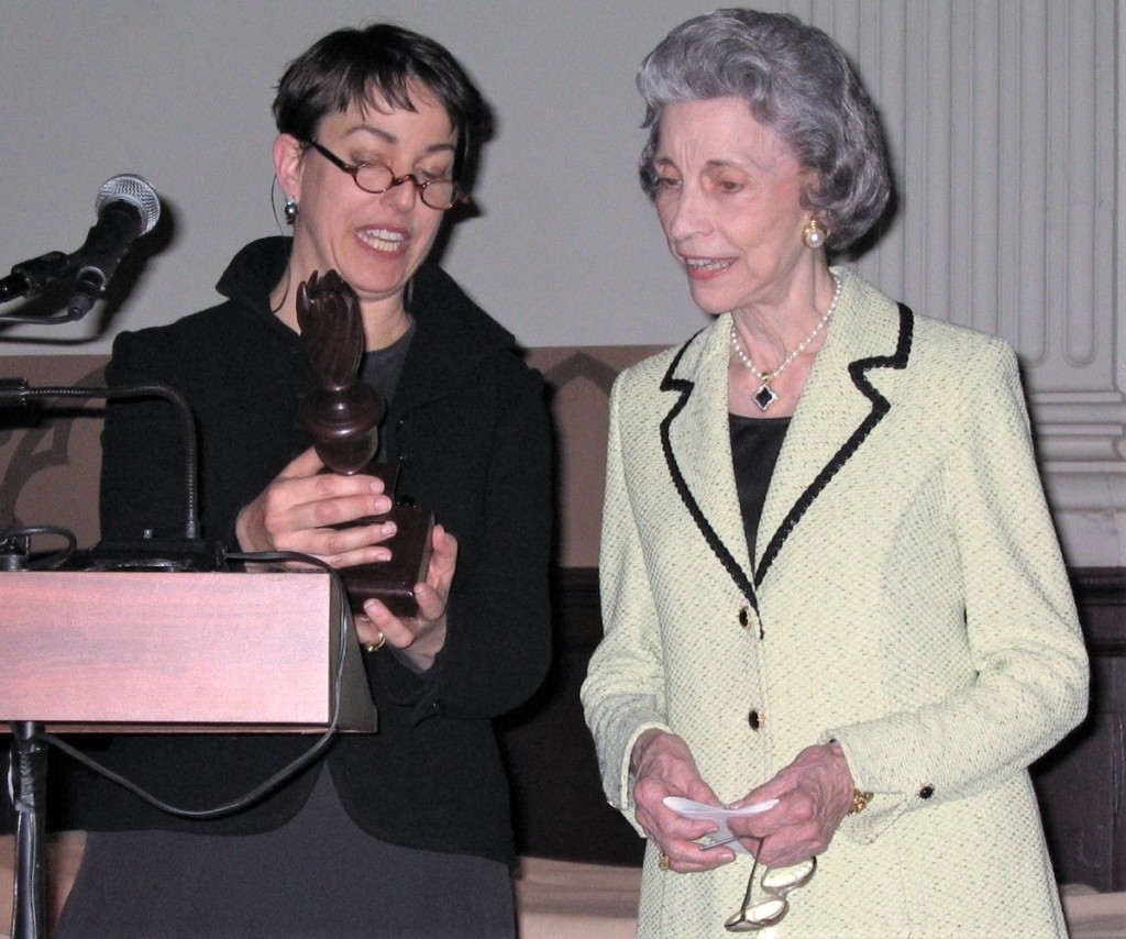 Philadelphia dealer Amy Finkel presents the 2005 Award of Merit trophy to Betty Ring.