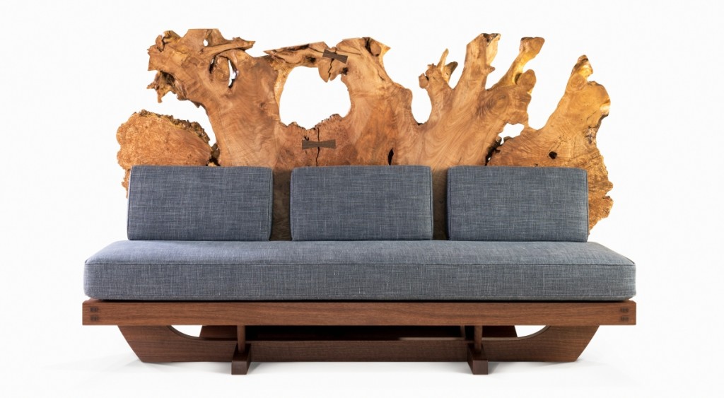 Mira Nakashima (b 1942), Tsuitate Sofa, designed in 2015, made in 2018. American black walnut, Oregon maple burl root, upholstery. Height 46 by width 75 by depth 37 inches. George Nakashima Woodworkers.