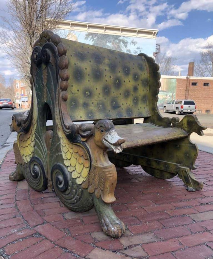 A Nineteenth Century double-sided carved carousel bench, carved with duck heads and other designs, realized $6,000. It had an original, untouched surface.