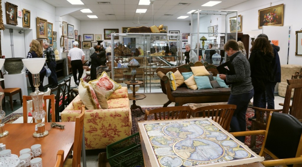 Prospective buyers peruse the last preview room at William J. Jenack Auctioneers.